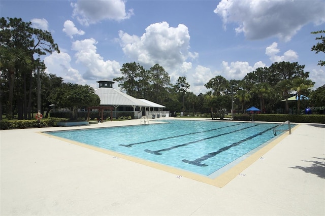 community pool featuring a patio area