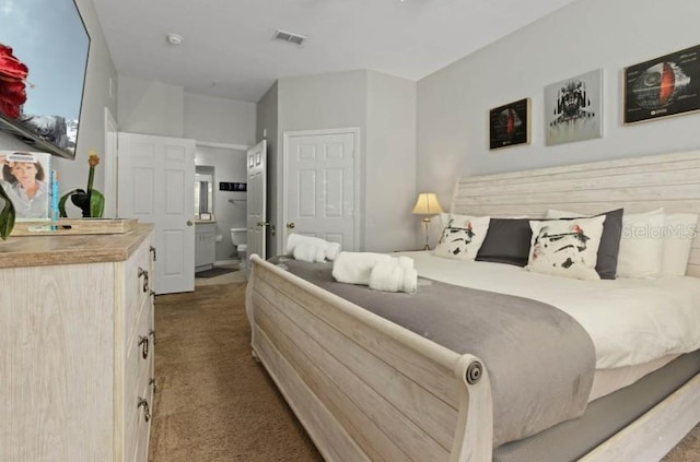 carpeted bedroom with visible vents