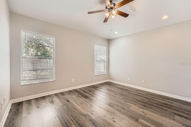 empty room featuring recessed lighting, ceiling fan, baseboards, and wood finished floors