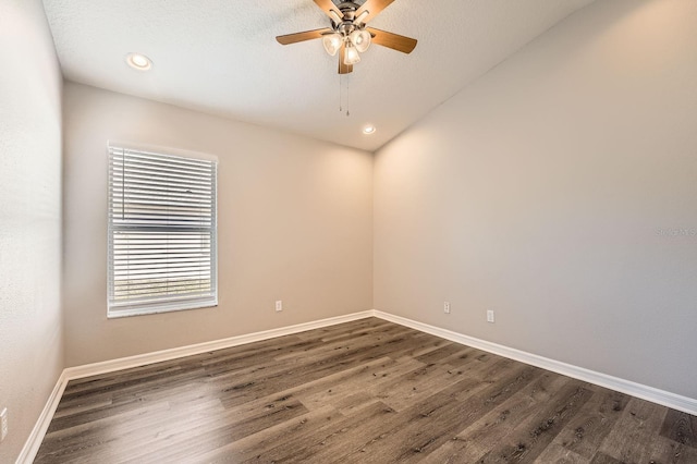 empty room featuring recessed lighting, baseboards, ceiling fan, and dark wood-style flooring