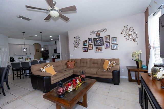 living area with visible vents, baseboards, ceiling fan, light tile patterned floors, and recessed lighting