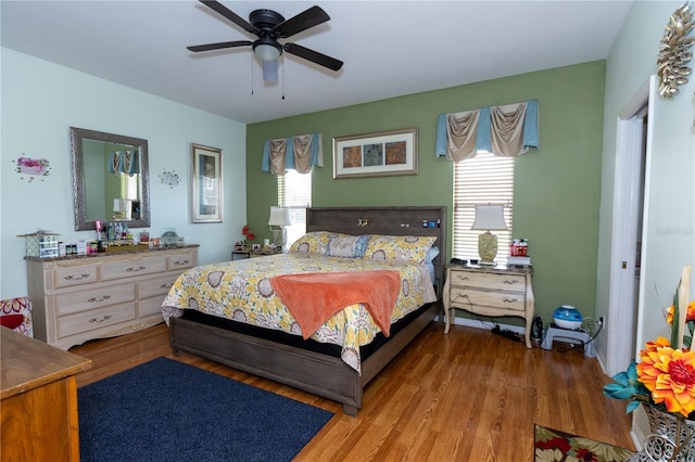 bedroom with wood finished floors and a ceiling fan