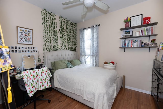 bedroom with baseboards, wood finished floors, and a ceiling fan