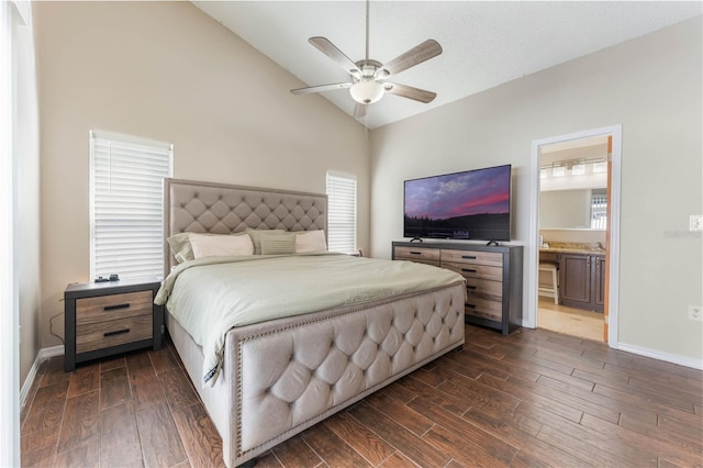 bedroom with baseboards, dark wood-type flooring, and lofted ceiling