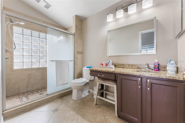 full bath featuring tile patterned flooring, a shower stall, toilet, vaulted ceiling, and vanity