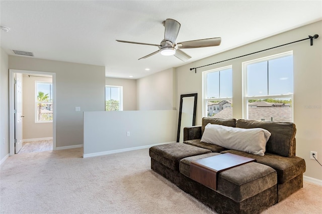 living area featuring light carpet, baseboards, visible vents, ceiling fan, and recessed lighting