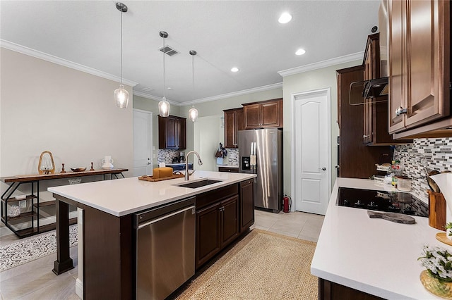 kitchen featuring visible vents, an island with sink, a sink, appliances with stainless steel finishes, and light countertops