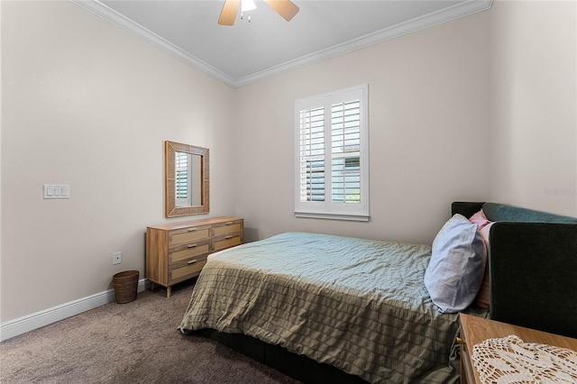 carpeted bedroom with baseboards, ornamental molding, and a ceiling fan