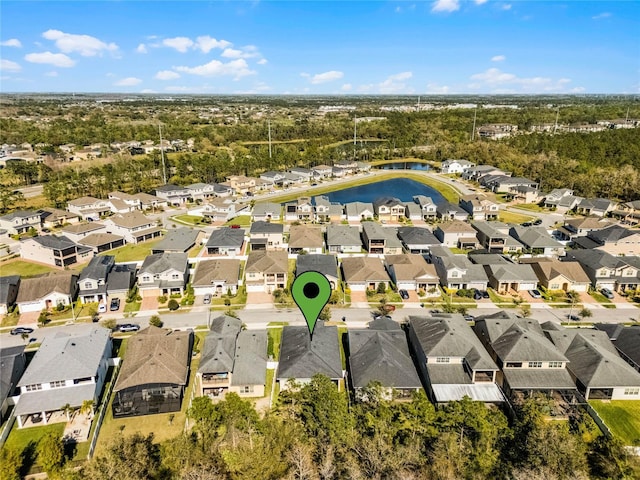 birds eye view of property with a residential view and a water view