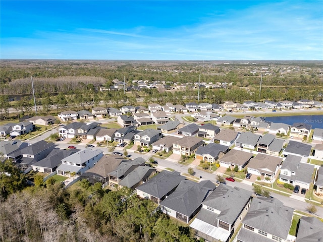 birds eye view of property with a residential view and a water view