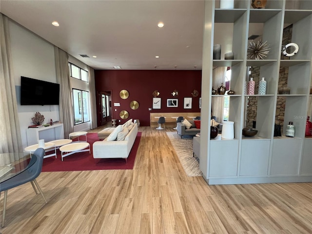 living area featuring visible vents, recessed lighting, and wood finished floors