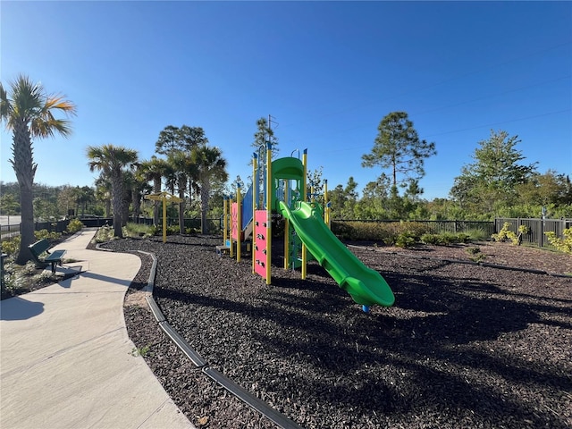 community play area featuring fence