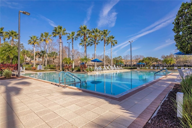 community pool with a patio