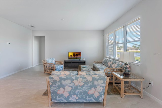 living room with visible vents and baseboards