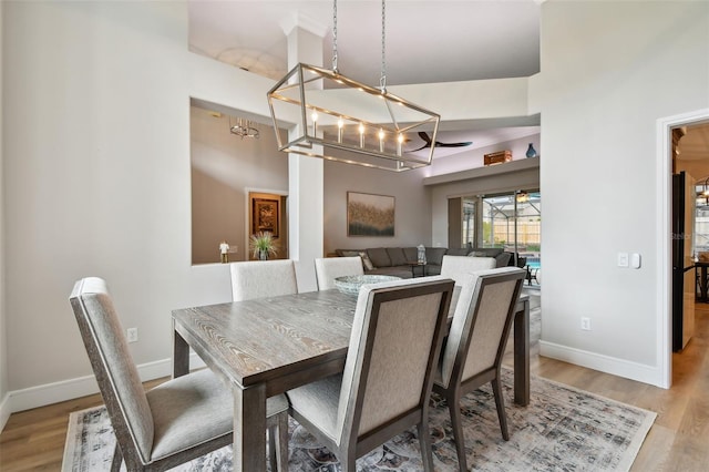 dining room with light wood-style floors and baseboards