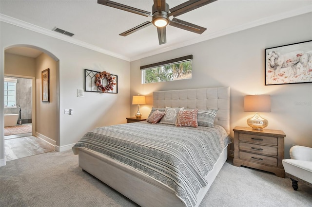 carpeted bedroom with crown molding, multiple windows, arched walkways, and visible vents