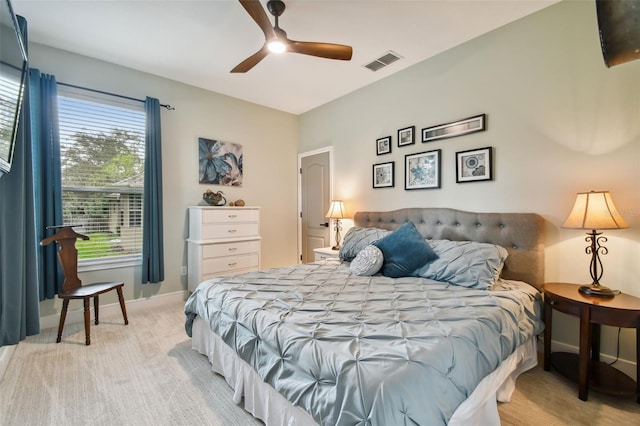 bedroom featuring light carpet, visible vents, ceiling fan, and baseboards