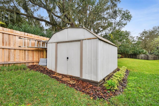 view of shed featuring a fenced backyard