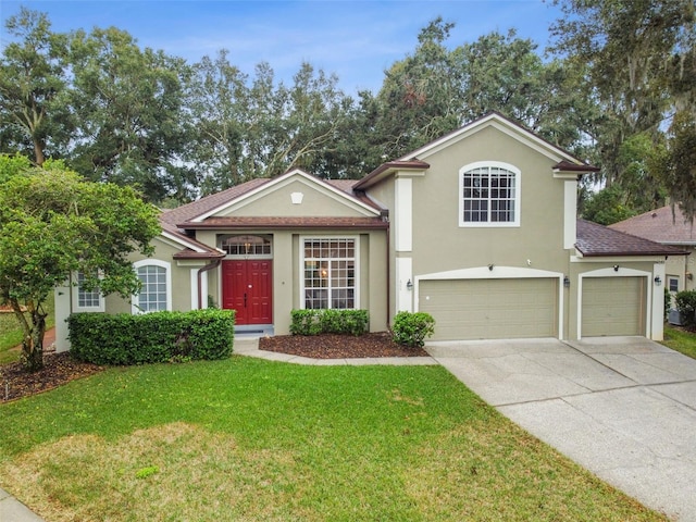 view of front facade featuring stucco siding, concrete driveway, and a front lawn