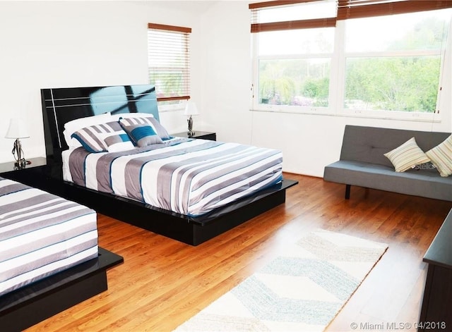 bedroom featuring light wood-style flooring