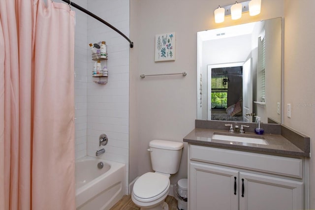 full bath featuring visible vents, vanity, toilet, and shower / bath combo with shower curtain