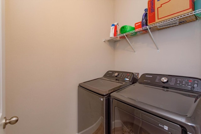 washroom with laundry area and washing machine and dryer