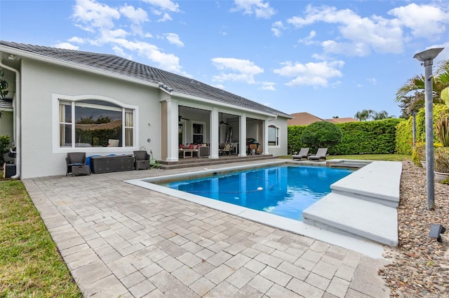 view of pool with a patio, a fenced in pool, fence, an exterior structure, and an outdoor structure