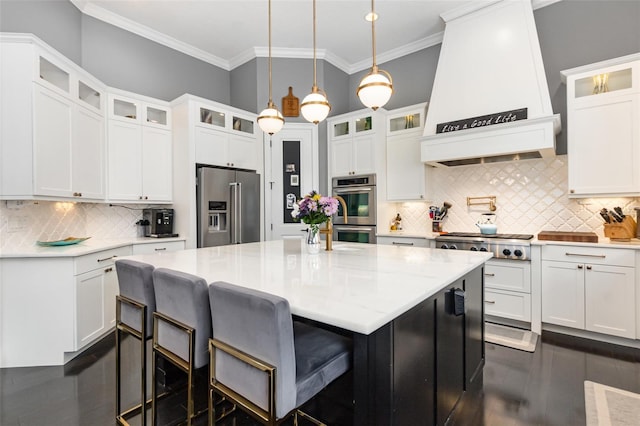 kitchen featuring custom exhaust hood, white cabinetry, and stainless steel appliances