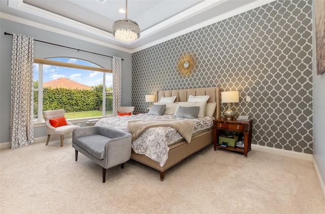 carpeted bedroom featuring wallpapered walls, a raised ceiling, and baseboards