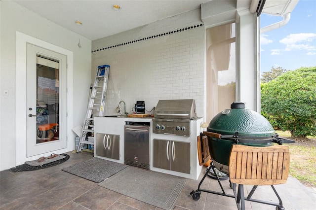 view of patio / terrace with area for grilling and a sink