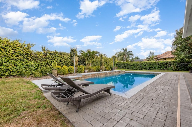 view of pool featuring a fenced in pool and a patio area