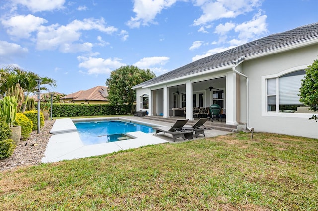 view of pool featuring a fenced in pool, fence, a ceiling fan, a patio area, and a lawn