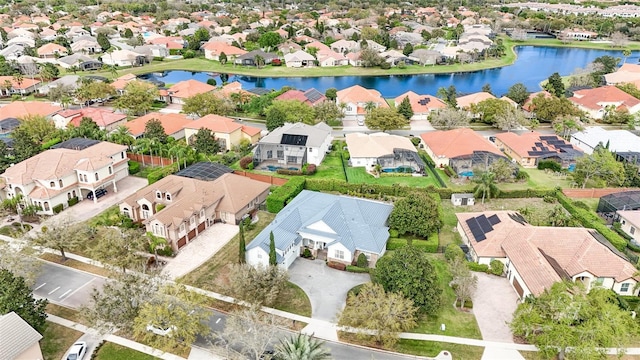 bird's eye view featuring a residential view and a water view