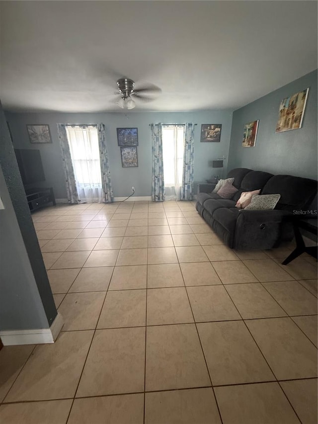 100 Huntswood Ct, Longwood, FL 32750 - living area with light tile patterned floors and ceiling fan