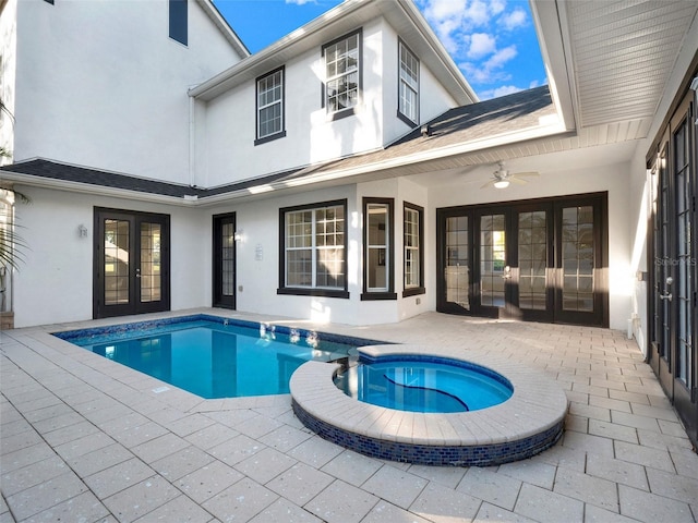 view of pool featuring a patio area, french doors, and a pool with connected hot tub