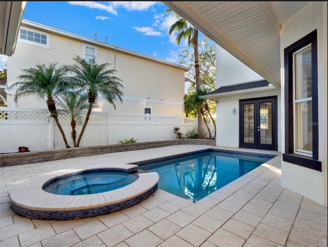 7548 Gathering Dr, Reunion, FL 34747 - view of pool featuring french doors, a pool with connected hot tub, fence private yard, and a patio area