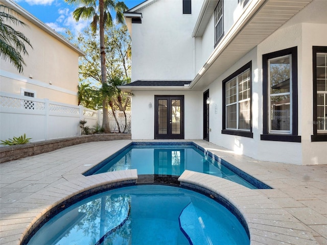 7548 Gathering Dr, Reunion, FL 34747 - view of pool with a patio area, french doors, a pool with connected hot tub, and fence
