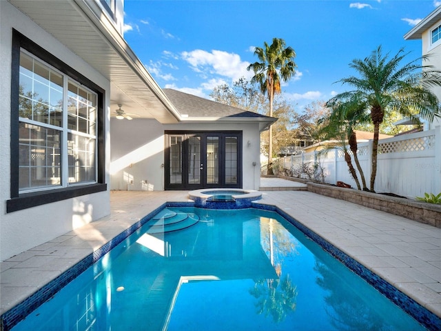 7548 Gathering Dr, Reunion, FL 34747 - view of swimming pool with french doors, a patio, a pool with connected hot tub, and fence