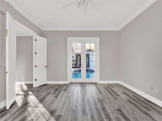 7548 Gathering Dr, Reunion, FL 34747 - empty room with crown molding, wood finished floors, and baseboards