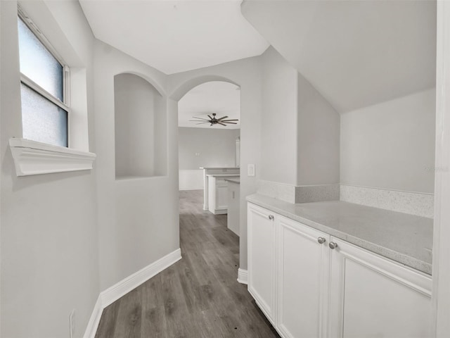 7548 Gathering Dr, Reunion, FL 34747 - hall featuring baseboards and dark wood-type flooring