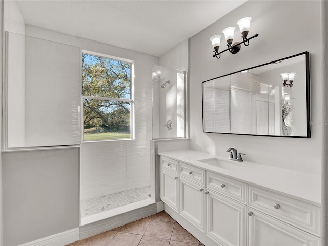 7548 Gathering Dr, Reunion, FL 34747 - full bathroom with vanity, an inviting chandelier, tile patterned flooring, and a tile shower
