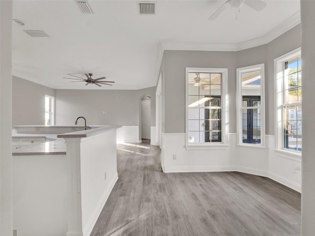 7548 Gathering Dr, Reunion, FL 34747 - interior space with visible vents, wainscoting, and plenty of natural light