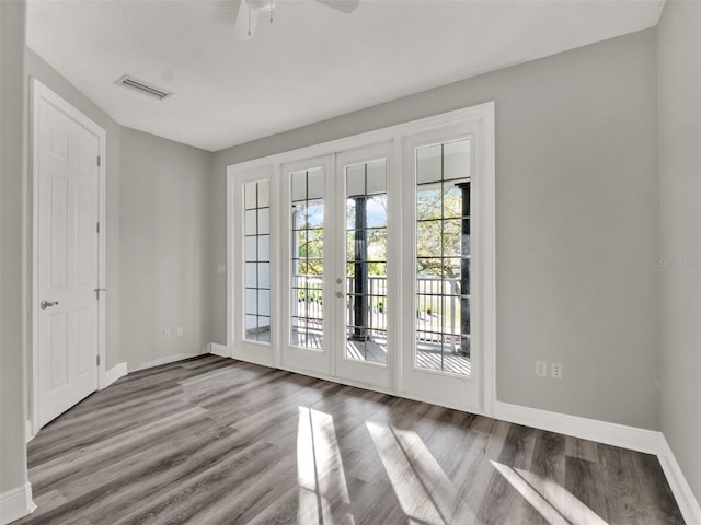 7548 Gathering Dr, Reunion, FL 34747 - entryway featuring visible vents, a ceiling fan, wood finished floors, french doors, and baseboards