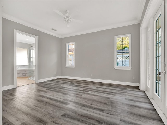 7548 Gathering Dr, Reunion, FL 34747 - unfurnished room with wood finished floors, baseboards, and ornamental molding
