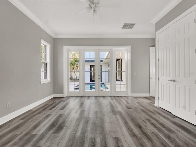 7548 Gathering Dr, Reunion, FL 34747 - unfurnished room with visible vents, french doors, baseboards, and ornamental molding