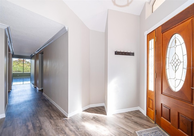 entryway featuring wood finished floors and baseboards