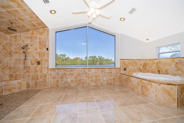 full bath featuring visible vents, tiled shower, a garden tub, and vaulted ceiling