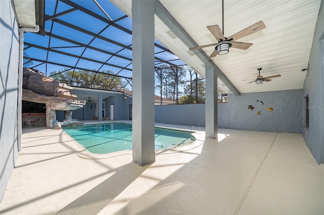 view of pool with a lanai, a patio area, a fenced in pool, and ceiling fan