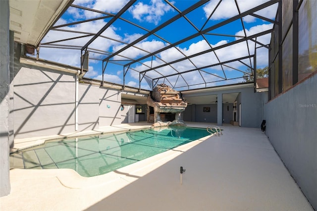 pool featuring a lanai and a patio