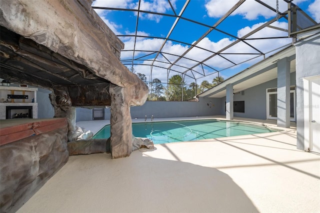 outdoor pool featuring a patio and a lanai